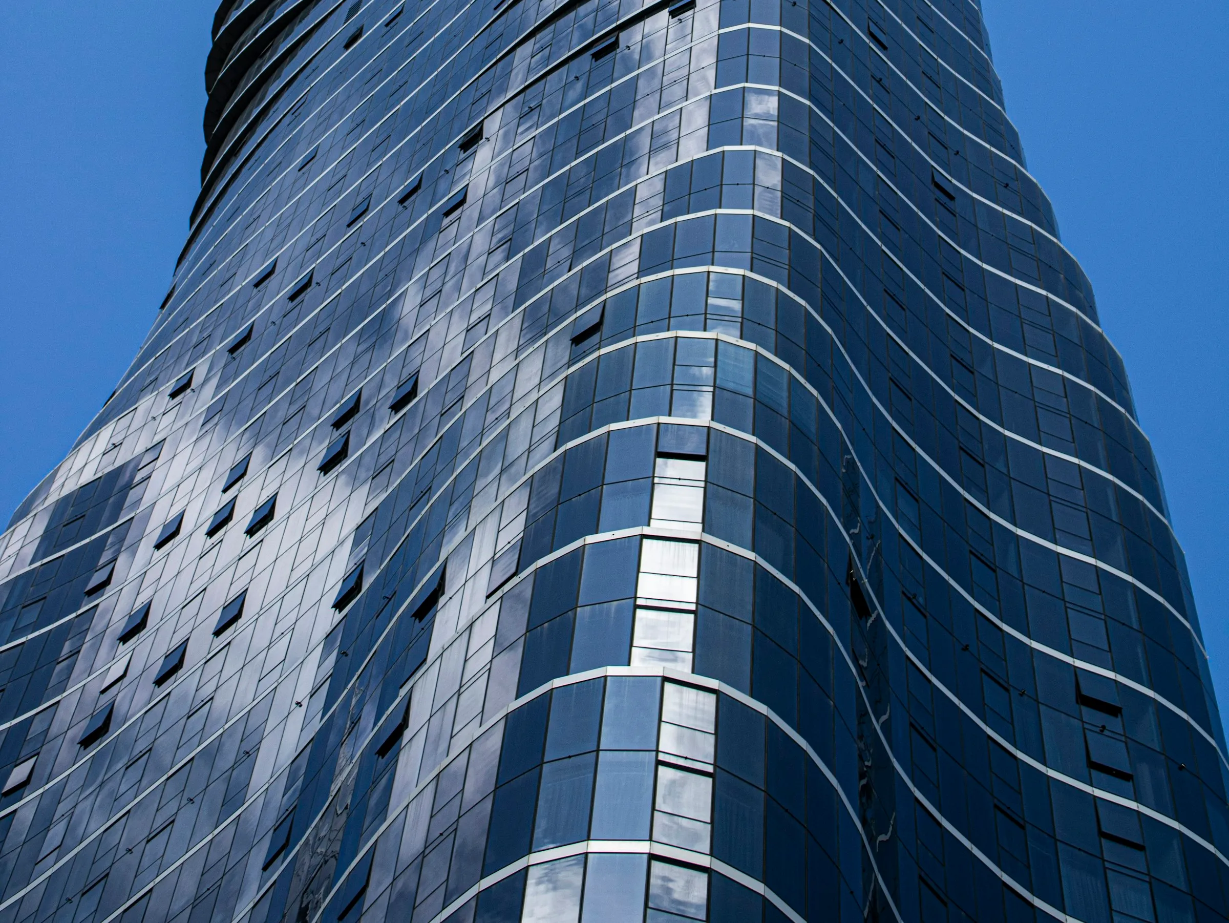 A curved glass curtain-wall tower in Melbourne